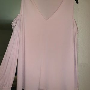 Light pink, cut outs on the shoulders.